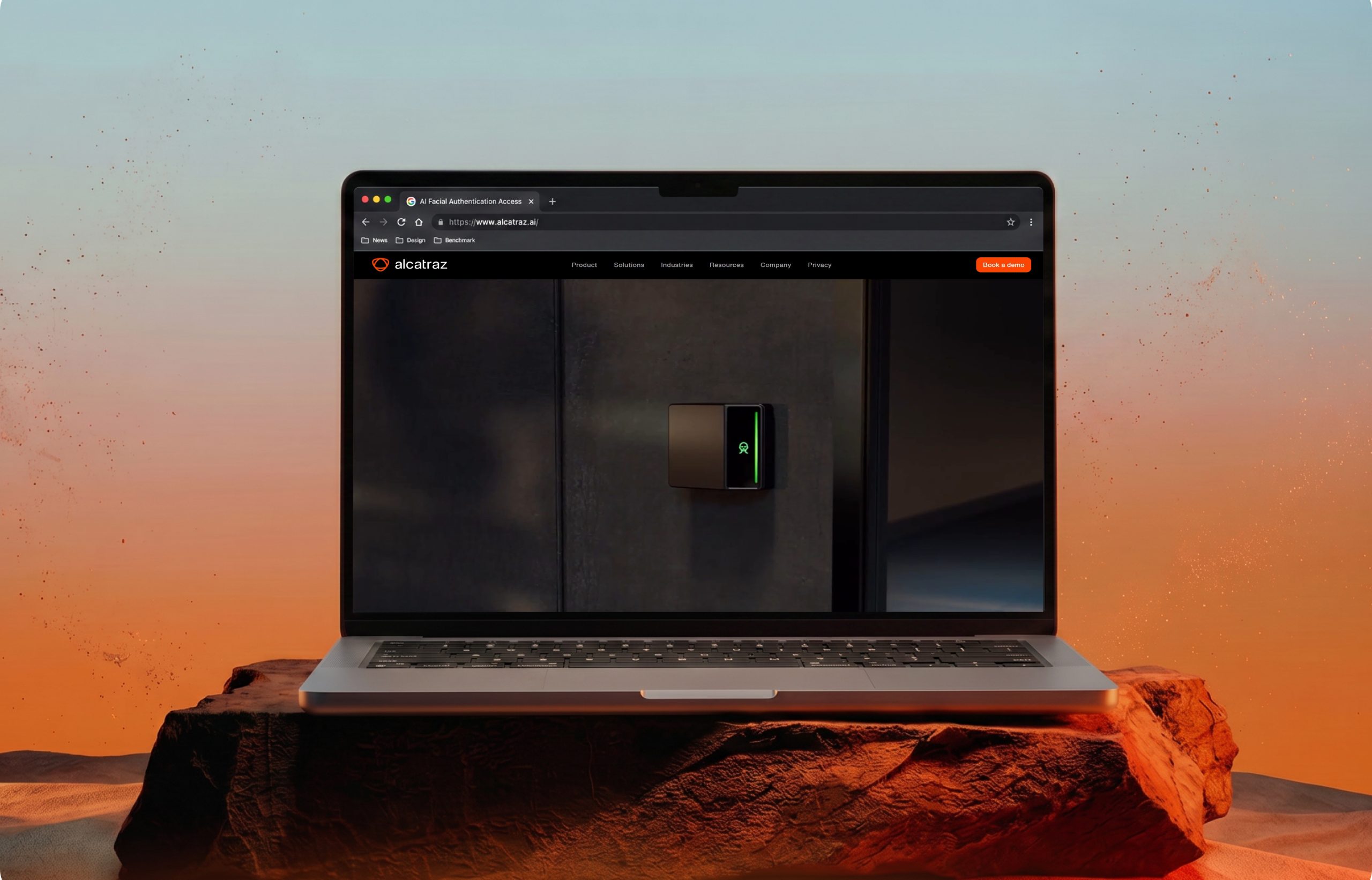 Alcatraz homepage on a laptop in a desert setting