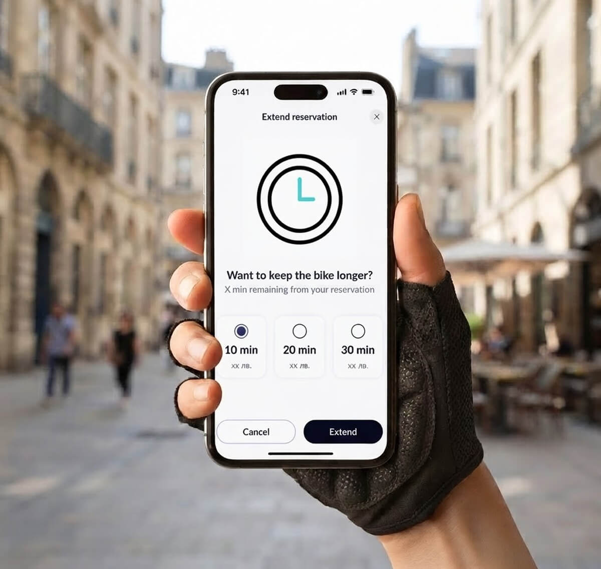Cyrcl app on a mobile screen showing extending a reservation, holded by a cyclist hand wearing a glove